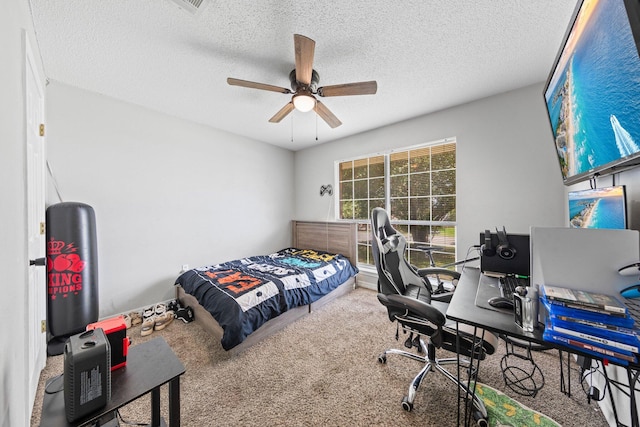 5123 Whitehurst Ln, Crestview, FL 32536 - bedroom featuring carpet flooring, an office area, a textured ceiling, and ceiling fan