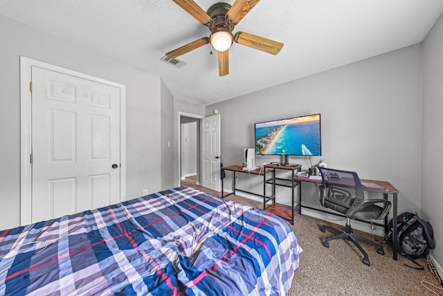 5123 Whitehurst Ln, Crestview, FL 32536 - carpeted bedroom with ceiling fan and a textured ceiling