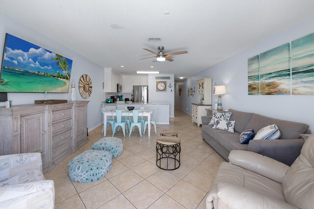 2606 Scenic Gulf Dr Unit 2412, Miramar Beach, FL 32550 - living room with light tile patterned floors, a ceiling fan, baseboards, and recessed lighting