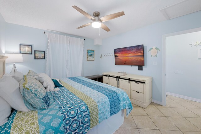 2606 Scenic Gulf Dr Unit 2412, Miramar Beach, FL 32550 - bedroom featuring light tile patterned flooring, a ceiling fan, baseboards, and attic access