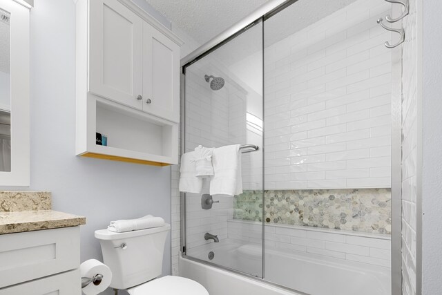 2606 Scenic Gulf Dr Unit 2412, Miramar Beach, FL 32550 - full bathroom with bath / shower combo with glass door, toilet, and vanity