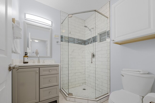 2606 Scenic Gulf Dr Unit 2412, Miramar Beach, FL 32550 - full bathroom with toilet, a shower stall, and vanity