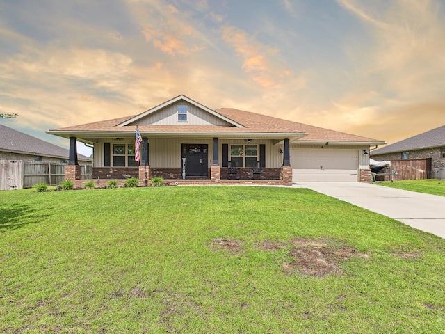 5740 Marigold Loop, Crestview, FL 32539 - craftsman-style home featuring concrete driveway, brick siding, a garage, covered porch, and board and batten siding