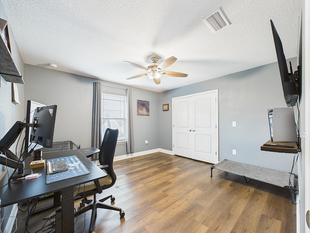 5740 Marigold Loop, Crestview, FL 32539 - office space with a ceiling fan, wood finished floors, a textured ceiling, and baseboards