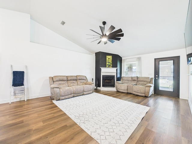 5740 Marigold Loop, Crestview, FL 32539 - living area featuring ceiling fan, lofted ceiling, a fireplace, wood finished floors, and baseboards