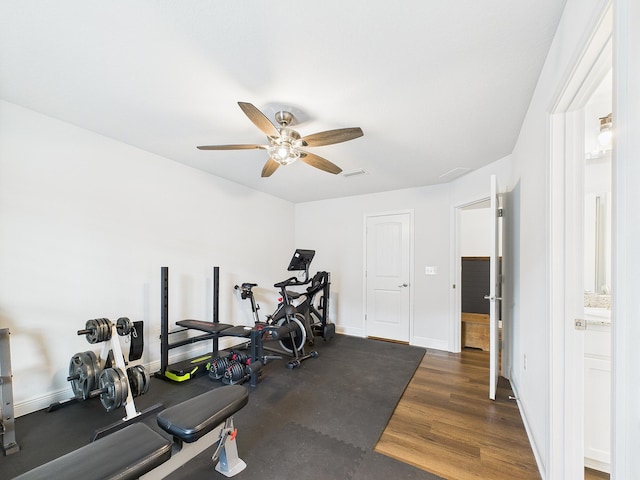 5740 Marigold Loop, Crestview, FL 32539 - workout area with ceiling fan, wood finished floors, and baseboards
