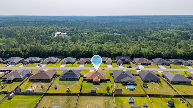 5740 Marigold Loop, Crestview, FL 32539 - aerial perspective of suburban area with a heavily wooded area