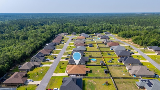 5740 Marigold Loop, Crestview, FL 32539 - aerial perspective of suburban area with a heavily wooded area