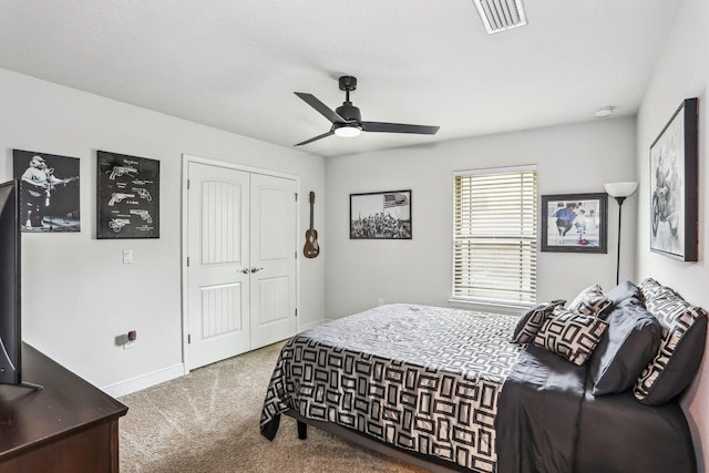5744 Periwinkle Ln, Crestview, FL 32539 - bedroom with carpet, a closet, baseboards, and a ceiling fan