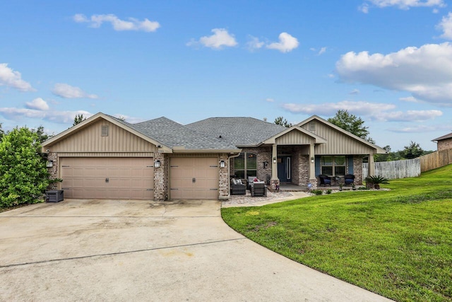 5744 Periwinkle Ln, Crestview, FL 32539 - view of front facade featuring a garage, brick siding, concrete driveway, and roof with shingles