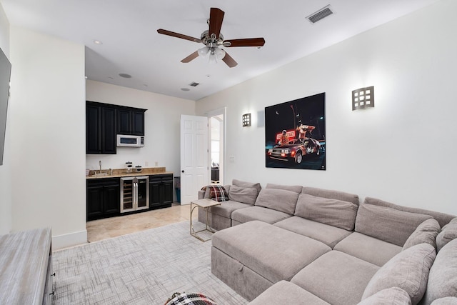 92 Carolyn Ln, Santa Rosa Beach, FL 32459 - living area with beverage cooler, a ceiling fan, and wet bar