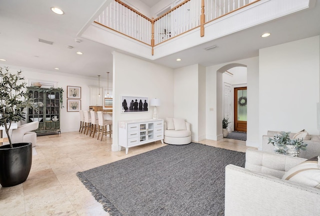 92 Carolyn Ln, Santa Rosa Beach, FL 32459 - living room featuring arched walkways, recessed lighting, crown molding, and a high ceiling