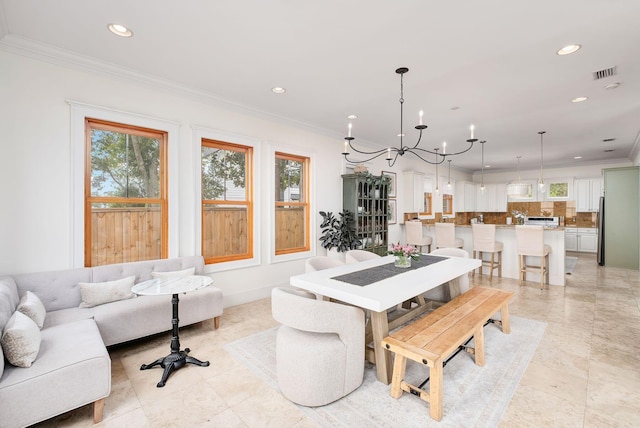92 Carolyn Ln, Santa Rosa Beach, FL 32459 - dining room featuring a chandelier, recessed lighting, and crown molding