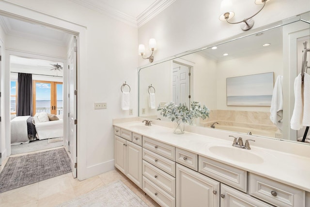 92 Carolyn Ln, Santa Rosa Beach, FL 32459 - ensuite bathroom featuring double vanity, ornamental molding, baseboards, tile patterned flooring, and a tub to relax in
