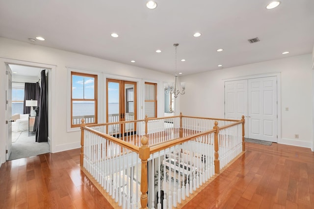 92 Carolyn Ln, Santa Rosa Beach, FL 32459 - corridor featuring an upstairs landing, hardwood / wood-style floors, recessed lighting, a chandelier, and baseboards