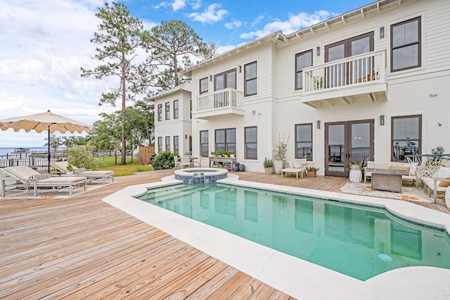 92 Carolyn Ln, Santa Rosa Beach, FL 32459 - view of pool featuring a pool with connected hot tub and a wooden deck