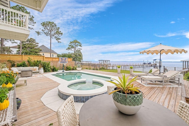 92 Carolyn Ln, Santa Rosa Beach, FL 32459 - view of pool featuring a deck with water view, a pool with connected hot tub, and an outdoor hangout area