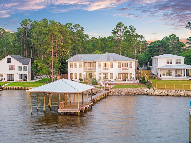92 Carolyn Ln, Santa Rosa Beach, FL 32459 - rear view of house featuring a water view, boat lift, metal roof, and a balcony