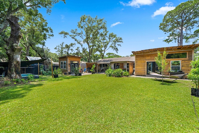 29 SE Alexandra Pl, Fort Walton Beach, FL 32548 - view of yard featuring an outbuilding and a patio