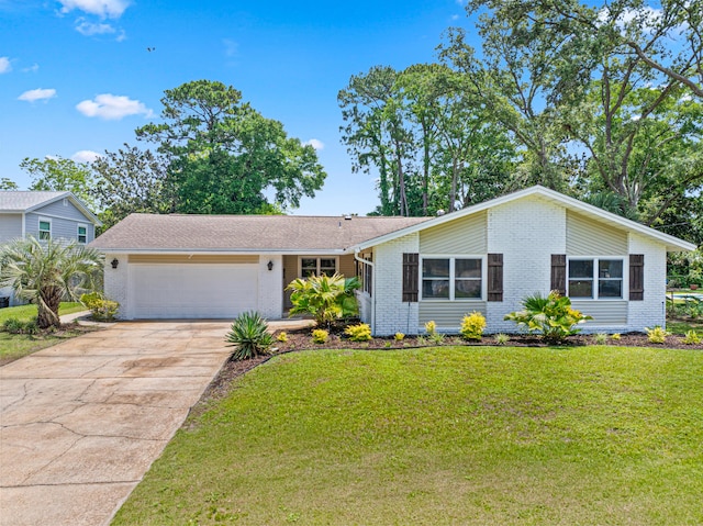 29 SE Alexandra Pl, Fort Walton Beach, FL 32548 - view of front of house featuring brick siding, a garage, driveway, and a front yard