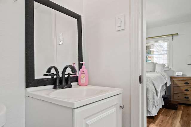 29 SE Alexandra Pl, Fort Walton Beach, FL 32548 - ensuite bathroom with vanity and wood finished floors