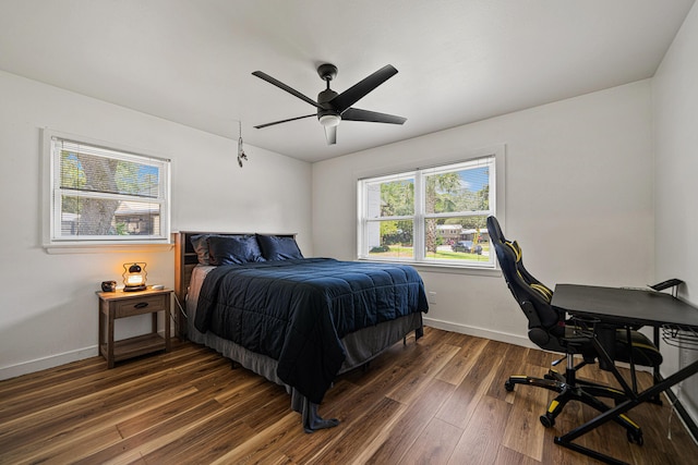 29 SE Alexandra Pl, Fort Walton Beach, FL 32548 - bedroom featuring dark wood-type flooring, baseboards, an office area, and a ceiling fan