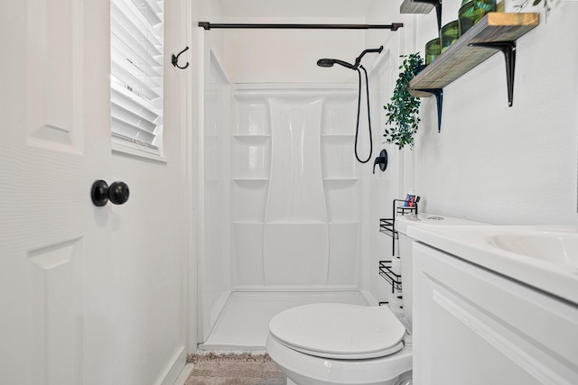 29 SE Alexandra Pl, Fort Walton Beach, FL 32548 - bathroom with a stall shower, vanity, and toilet