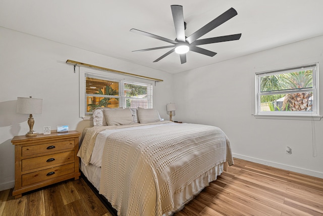 29 SE Alexandra Pl, Fort Walton Beach, FL 32548 - bedroom featuring wood finished floors, baseboards, and ceiling fan