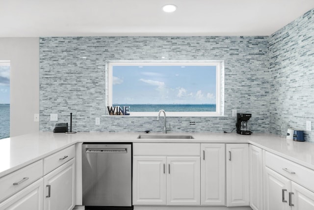 14351 State Highway 20, Niceville, FL 32578 - kitchen featuring stainless steel dishwasher, white cabinets, tasteful backsplash, light countertops, and recessed lighting