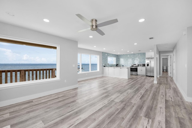 14351 State Highway 20, Niceville, FL 32578 - unfurnished living room featuring a ceiling fan, light wood-style flooring, and recessed lighting