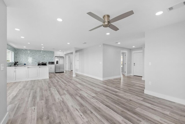 14351 State Highway 20, Niceville, FL 32578 - unfurnished living room with ceiling fan, light wood finished floors, and recessed lighting