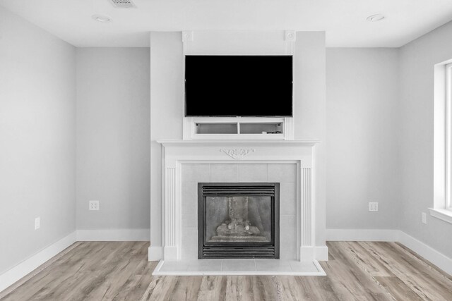 14351 State Highway 20, Niceville, FL 32578 - detailed view of wood finished floors and a tile fireplace