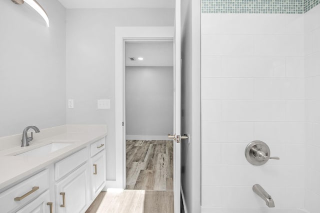 14351 State Highway 20, Niceville, FL 32578 - bathroom featuring wood finished floors, vanity, and shower / bath combination