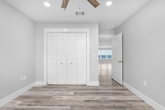14351 State Highway 20, Niceville, FL 32578 - unfurnished bedroom featuring recessed lighting, a closet, wood finished floors, and a ceiling fan