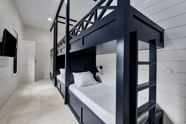 7570 E County Highway 30a, Watersound, FL 32461 - bedroom featuring wood walls