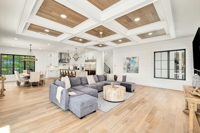 7570 E County Highway 30a, Watersound, FL 32461 - living area with coffered ceiling, light wood-style floors, recessed lighting, beamed ceiling, and stairs
