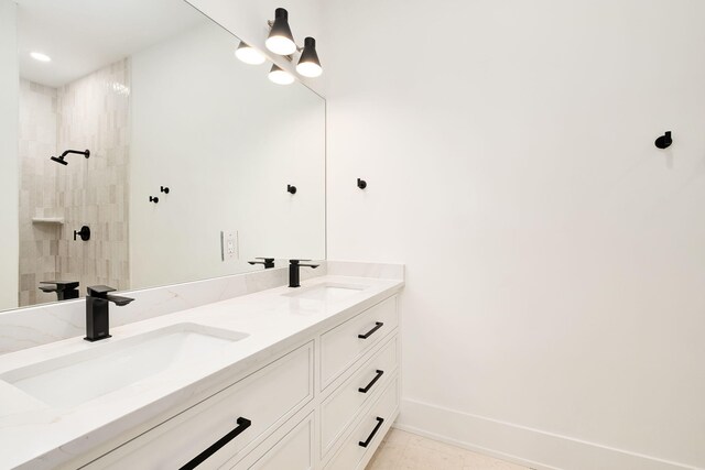 7570 E County Highway 30a, Watersound, FL 32461 - full bath featuring double vanity, tiled shower, baseboards, and recessed lighting