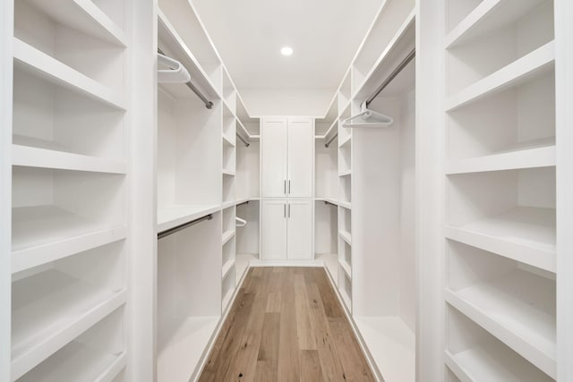 7570 E County Highway 30a, Watersound, FL 32461 - walk in closet with light wood-style floors