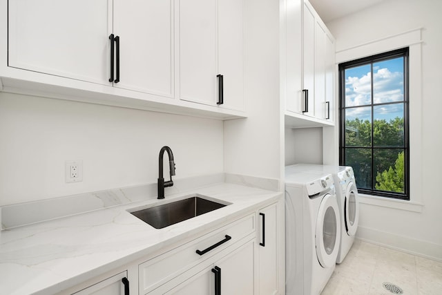 7570 E County Highway 30a, Watersound, FL 32461 - laundry area with cabinet space, washer and dryer, and baseboards