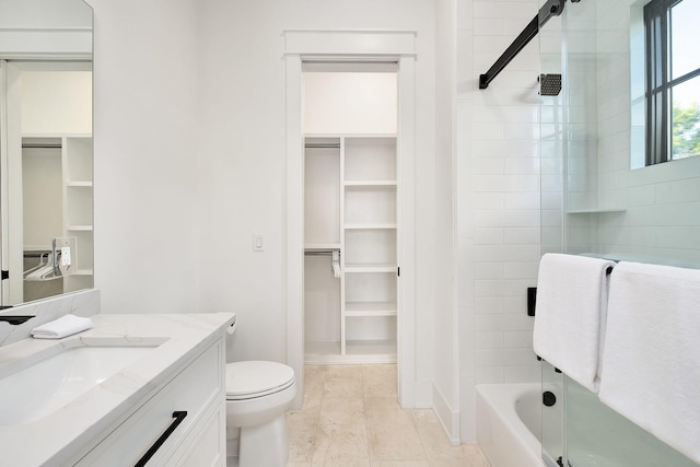 7570 E County Highway 30a, Watersound, FL 32461 - bathroom featuring a spacious closet, vanity, toilet,  shower combination, and baseboards