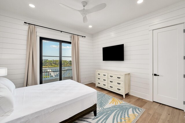 7570 E County Highway 30a, Watersound, FL 32461 - bedroom with wooden walls, access to outside, light wood-type flooring, recessed lighting, and a ceiling fan