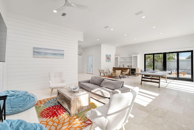 7570 E County Highway 30a, Watersound, FL 32461 - living area featuring wood walls, recessed lighting, and ceiling fan