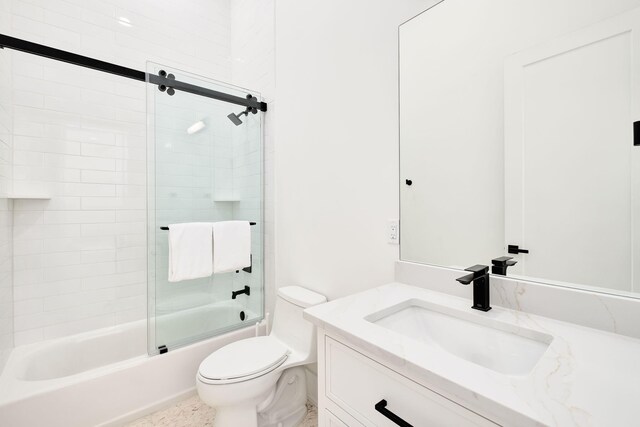 7570 E County Highway 30a, Watersound, FL 32461 - bathroom featuring vanity, toilet, and shower / bath combination with glass door