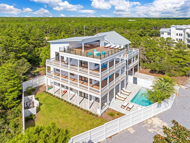 7570 E County Highway 30a, Watersound, FL 32461 - view of subject property with a forest and a pool