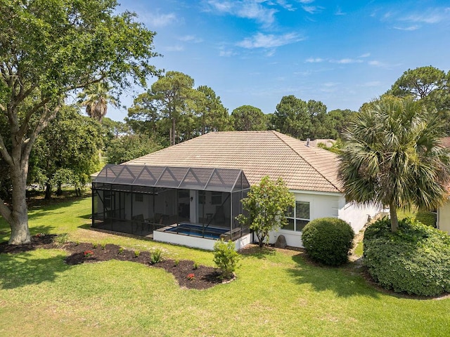 359 Indigo Loop, Miramar Beach, FL 32550 - back of property with a tile roof, a yard, an outdoor pool, stucco siding, and a lanai