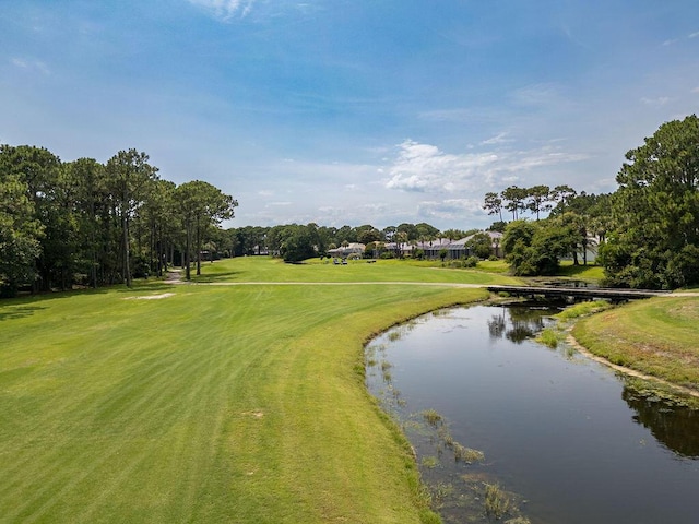 359 Indigo Loop, Miramar Beach, FL 32550 - view of home's community with a water view, view of golf course, view of wooded area, and a lawn