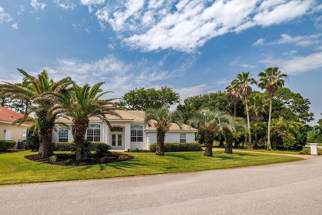 359 Indigo Loop, Miramar Beach, FL 32550 - view of front of property with french doors, a front yard, stucco siding, and cooling unit