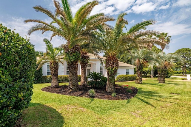 359 Indigo Loop, Miramar Beach, FL 32550 - view of property exterior featuring a lawn and stucco siding