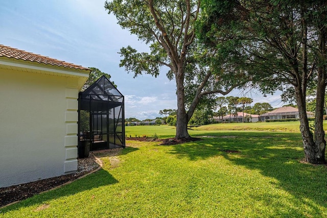 359 Indigo Loop, Miramar Beach, FL 32550 - view of grassy yard featuring glass enclosure