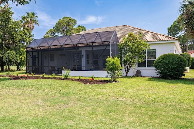 359 Indigo Loop, Miramar Beach, FL 32550 - back of property with a yard, a tile roof, and a lanai